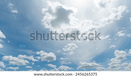 various cloud forms paint over an otherwise beautiful blue sky Royalty-Free Stock Photo #2456265375