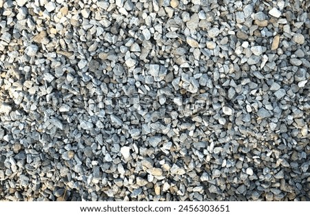 Macro view of dark gray rocks,
 stone ,gravels texture background.in construction site.
Pile of  for building the house Industrial object photo
