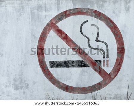 
A no smoking sign is drawn on a white wall