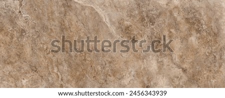 Textured surface of a beige marble with intricate white and gray veins and natural stone patterns, giving it a rustic and elegant appearance.