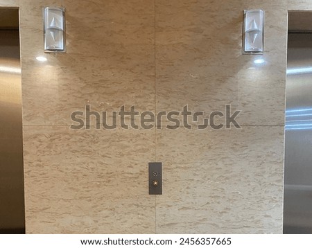 Elevator button with 2 lights with marble background