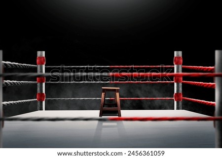 An empty stool inside the ring with no people in the gym. Place for boxing, wrestling, presentation of match, competition