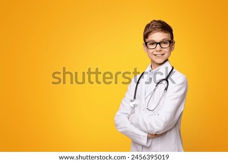 A young boy wearing a white lab coat and glasses stands confidently, showcasing his curiosity and ambition in a scientific environment.