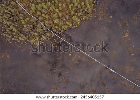 Aerial view of Viiankiaapa Mire Reserve in cloudy spring weather, Sodankylä, Lapland, Finland. Swampy land and wetland, marsh, bog.