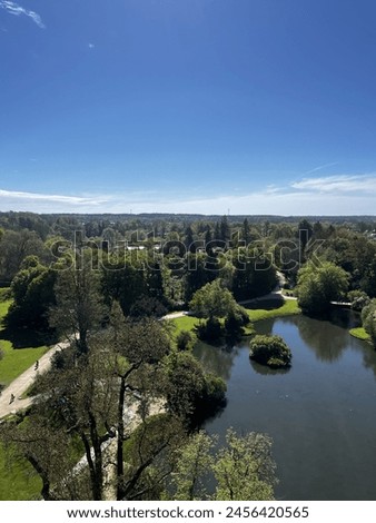 A large, beautiful lake, top view, surrounded by a well-kept park with beautiful trees, nature Royalty-Free Stock Photo #2456420565
