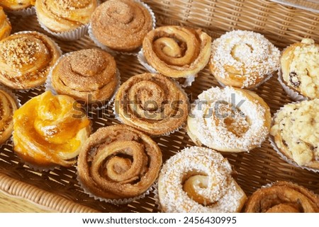 Rows of Delectable Freshly Baked Danish Rolls and Pastries in the Bakery Royalty-Free Stock Photo #2456430995