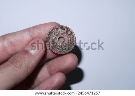 1945 Nederlandsch Indie 1 Cent coin look behind. Royalty-Free Stock Photo #2456471257