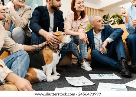 Successful managers, employees meeting, working together, planning project, brainstorming. Beautiful dog sitting in modern office, animal friendly. Concept of teamwork, strategy planning