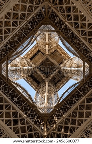 Detail of Eiffel Tower - looking up from underneath Royalty-Free Stock Photo #2456500077