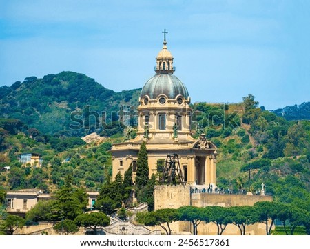 Tempio di Cristo Re church hight on a hill in Messina, Sicily, Italy. In addition to grand architecture it offers magnificent view of the city and strait of Messina