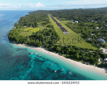 The airport by the sea in Melonguane, Talaud Islands Royalty-Free Stock Photo #2456524915