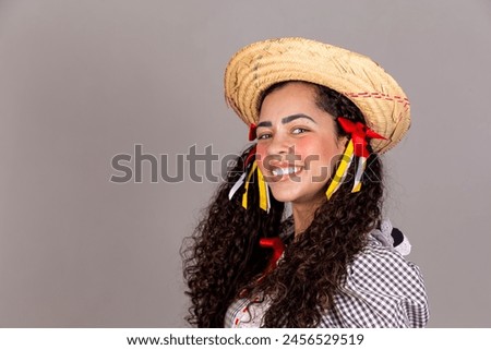 Closeup of afro woman dressed in typical June festival clothes