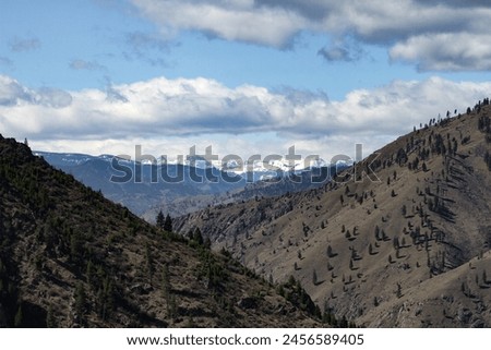 Springtime photo of the salmon river canyon in Idaho with the seven devils mountains in the background