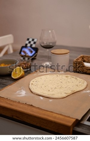 Pizza dough, movie evening, red wine, lemon, recipe, homemade pizza Royalty-Free Stock Photo #2456607587