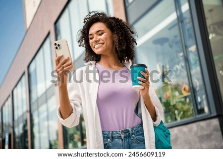 Photo of dreamy cute woman dressed white shirt rucksack enjoying tea tacking selfie modern gadget outdoors urban city street