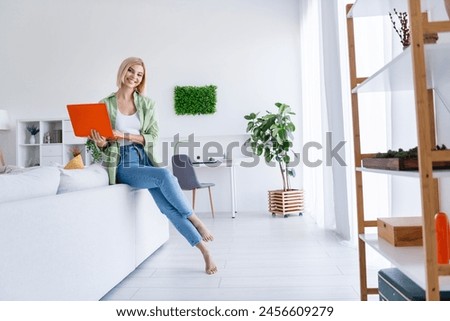Photo of positive successful woman professional office smm manager chatting online browsing media sms message indoors