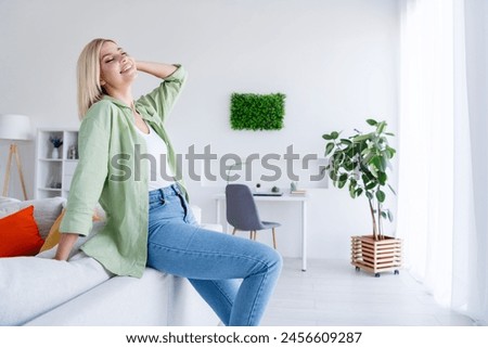 Photo of adorable sweet dreamy girl closed eyes enjoying sunny weekend morning in comfy modern interior room indoors Royalty-Free Stock Photo #2456609287