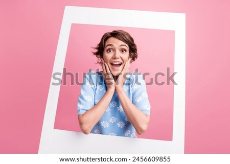 Portrait of impressed pretty person hands touch cheeks open mouth album set card isolated on pink color background