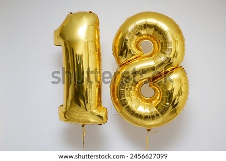 golden balloons number 18 on white background