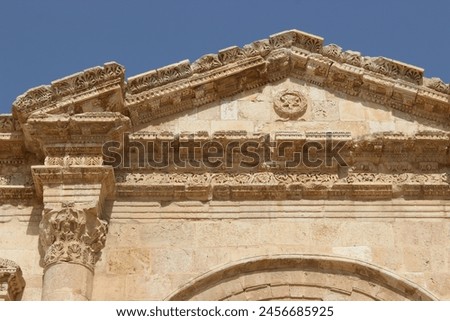 Entrance to the Greco Roman city in Jerash - Greco Roman building Royalty-Free Stock Photo #2456685925