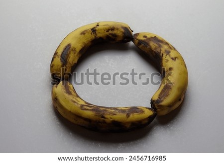 Three rotten banana isolated on white background. Three banana put in round shape.