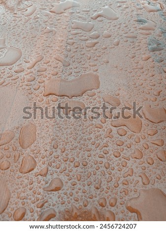 puddle of water on the table after the rain