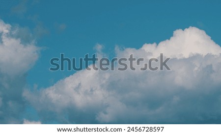 Pink Clouds Against Blue Sky At Sunset. Sunrise Clouds Are In Pink Vanilla Colours. Royalty-Free Stock Photo #2456728597