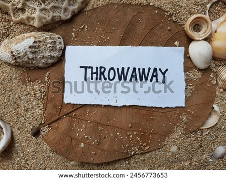 Throwaway writting on beach sand background. Royalty-Free Stock Photo #2456773653