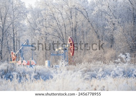Pumpjack Who knew oil pumps could look so mesmerizing against a backdrop of shiny frost? Nature Inspired Oil Fields Magical Scenery
