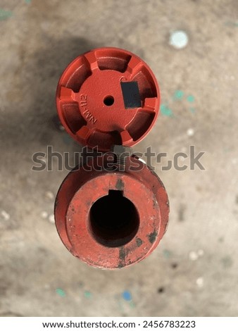 This picture is a couple of objects or items used to connect the driving motor to the water rotation drive or what could be called water circulation