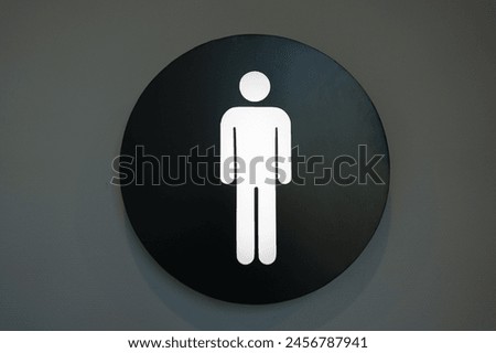 Men Restroom Sign on Wall close up