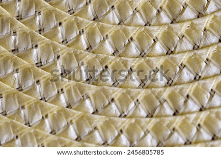 close up of straw mat,yellow background with a pattern