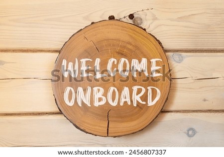 Welcome onboard symbol. Concept words Welcome onboard on beautiful wooden circle. Beautiful wooden wall background. Business, motivational welcome onboard concept. Copy space.