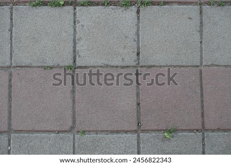 Background - stack bond brick like gray and pink concrete pavement