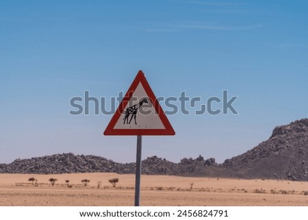 Giraffe warning sign along the C27, Namibia
