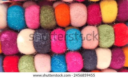Multi colored felt bag rug. beautiful wool color background. colorful texture. Royalty-Free Stock Photo #2456859455