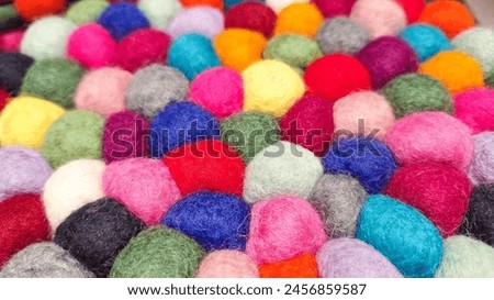 Multi colored felt bag rug. beautiful wool color background. colorful texture. Royalty-Free Stock Photo #2456859587