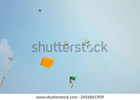 travel photography of kite flying festival on the beach during summer school holiday in Jakarta