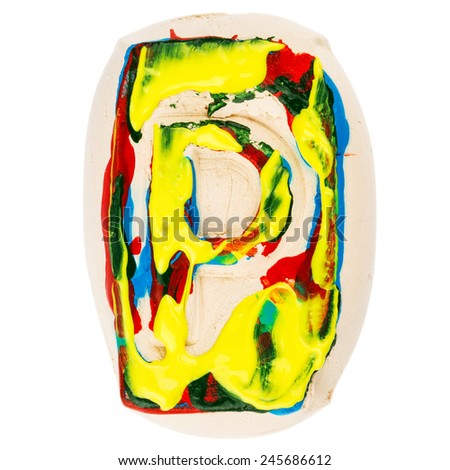 Handmade of white clay letter P painted with colorful acrylic paints isolated on white
