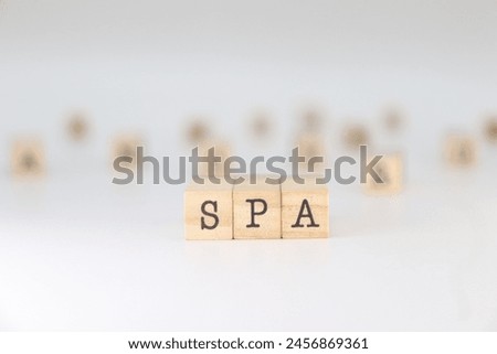 SPA word. Concept of Single Page Application written on wooden cubes isolated on white background