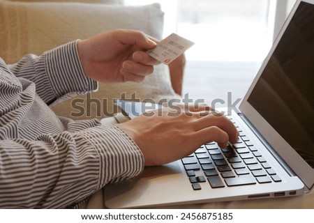 A man who enters credit card information