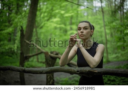 Girl with a camera exploring the lush green forest, capturing its beauty through the lens of her camera