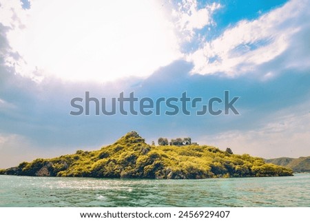 The air is alive with the melody of exotic birdsong and the rustle of leaves, a harmonious chorus that serenades your senses and lulls you into a state of blissful reverie. Royalty-Free Stock Photo #2456929407