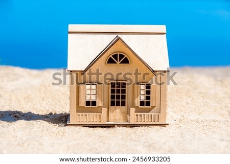 The symbol of the house standing on the seashore