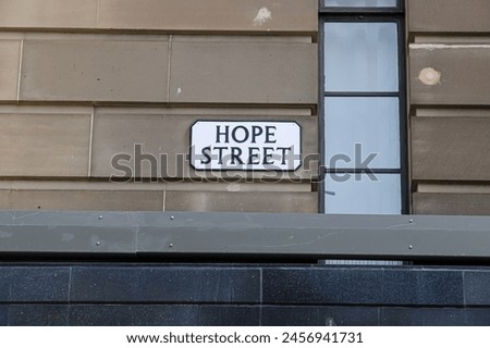 Traditional Street Name Sign for Hope Street on a Sandstone Building Off Princes Street in Edinburgh Scotland