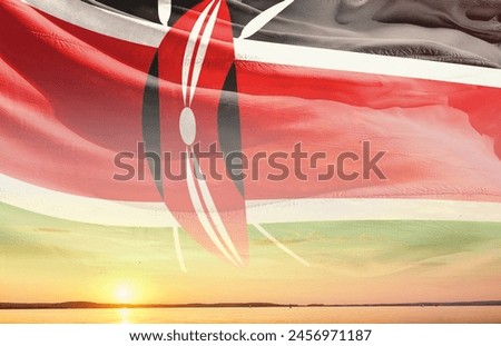Kenya national flag waving in the sky.
