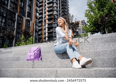 Photo of cheerful lovely cute woman relaxing and enjoying beautiful summer weather sunshine outside