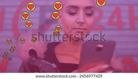 Image of media icons over caucasian woman using smartphone. social media and communication interface concept digitally generated image.