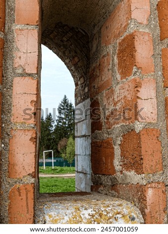 Loopholes of the old fortress. Royalty-Free Stock Photo #2457001059