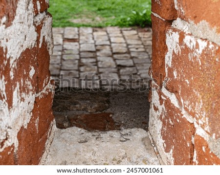 Loopholes of the old fortress. Royalty-Free Stock Photo #2457001061